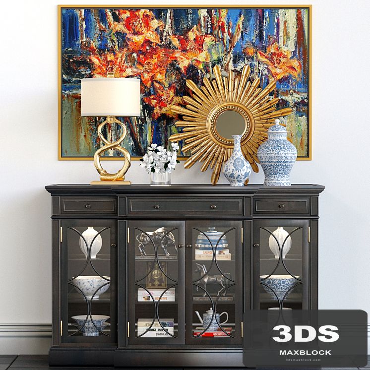 A chest of drawers with a collection of decor, a lamp and a set of sculptures