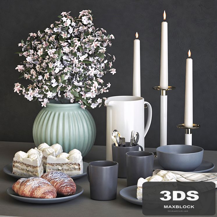 A set of dishes IKEA with a croissant and cake